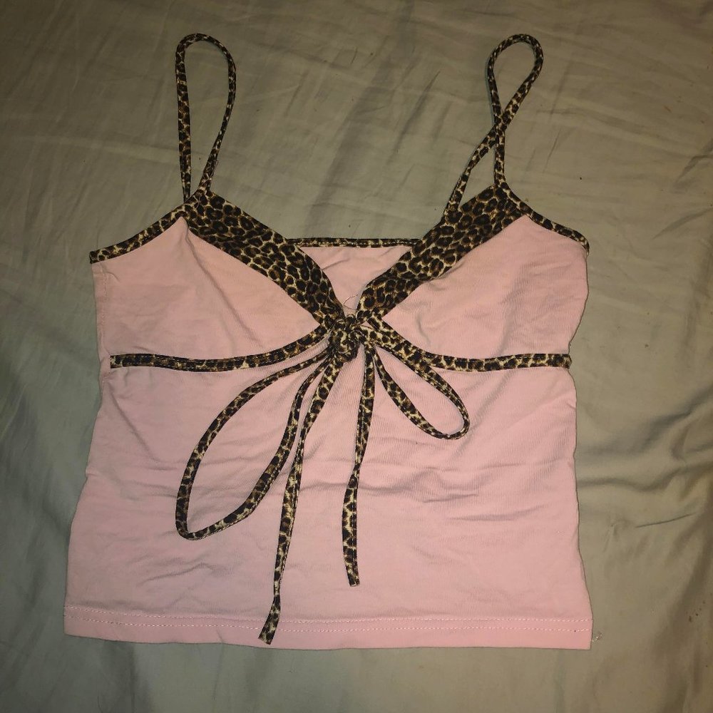 Y2K style pink crop tank top with leopard print straps, lining and bow